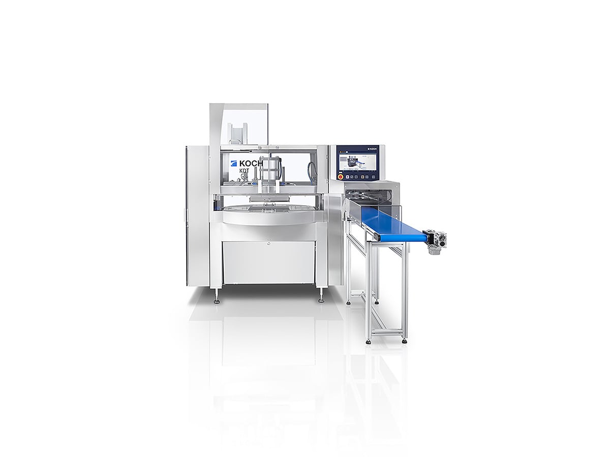 KOCH KDT turntable machine with round sealing table, touchscreen and blue output conveyor