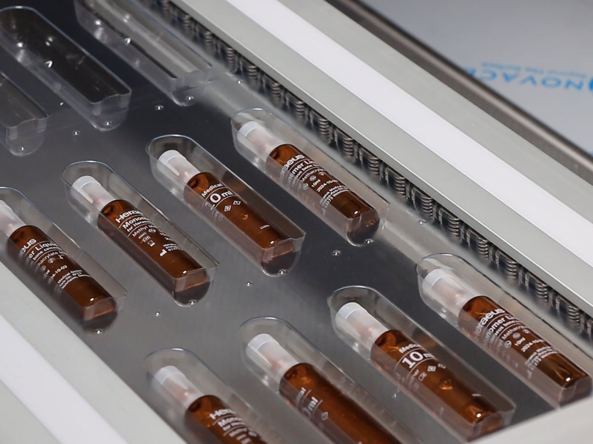 Brown glass ampoules resting individually in the cavities of a transparent blister web
