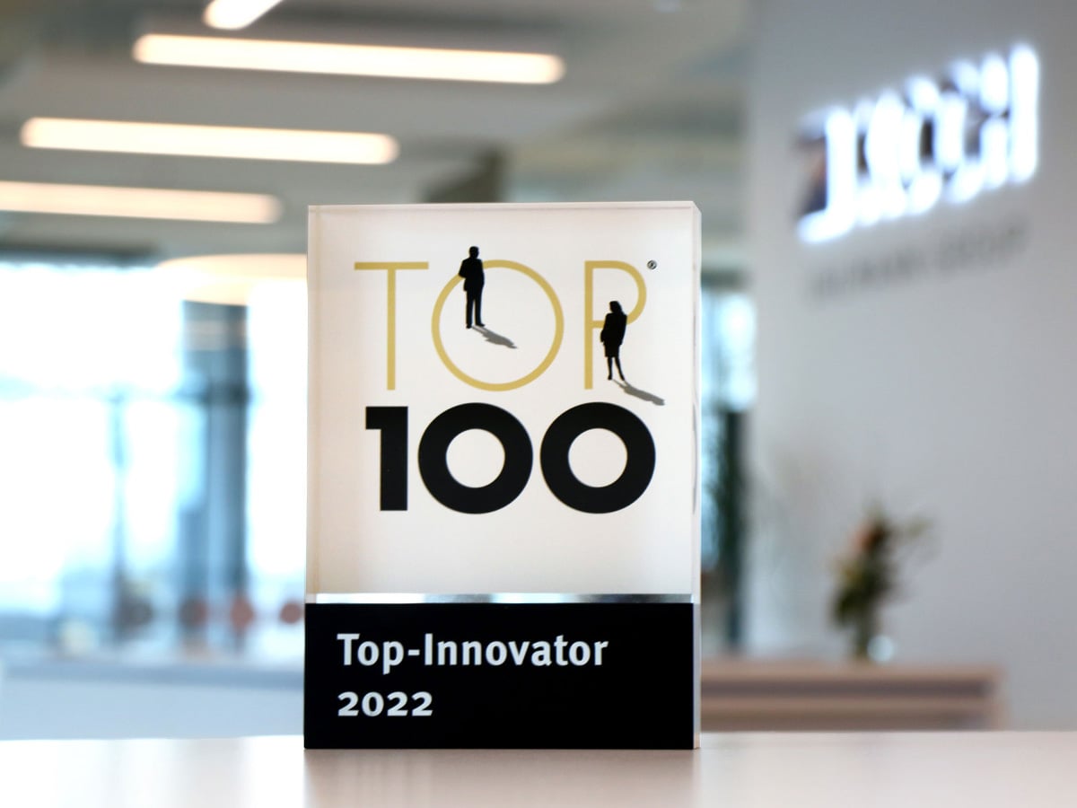 TOP 100 Top-Innovator 2022 award trophy displayed in the KOCH Pac-Systeme reception area
